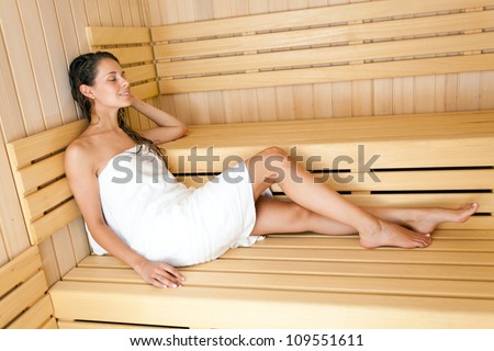 Beautiful woman relaxing a sauna