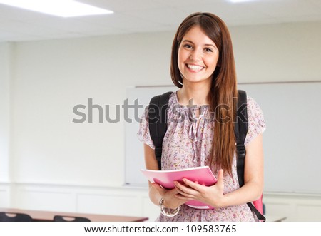 Portrait of a young cute student in her classroom