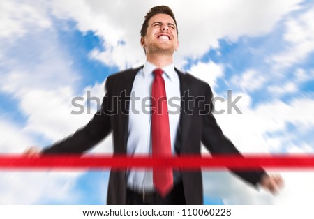 Successful businessman crossing the line