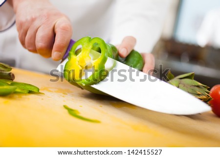 Chef preparing vegetables in his kitchen