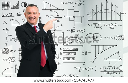 Businessman in front of math formulas