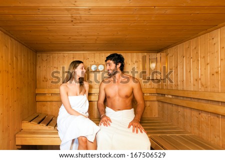 Couple having a sauna bath in a steam room
