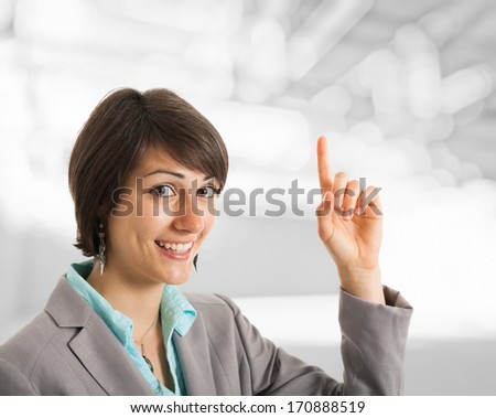 Businesswoman pointing her finger up