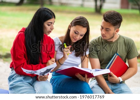 Group of students studying outdoor in park near school, college or university Сток-фото © 