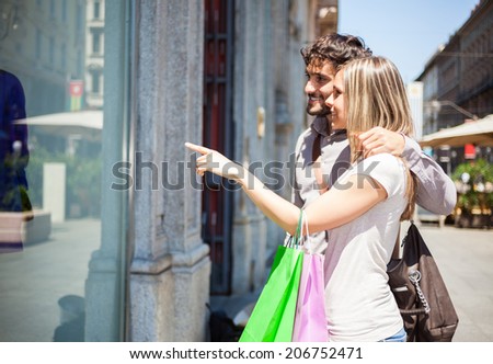 Couple doing shopping in a urban street