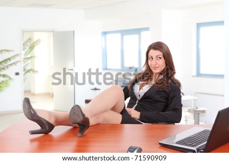 Beautiful Businesswoman Legs Laying On The Desk In Front Of A Laptop ...