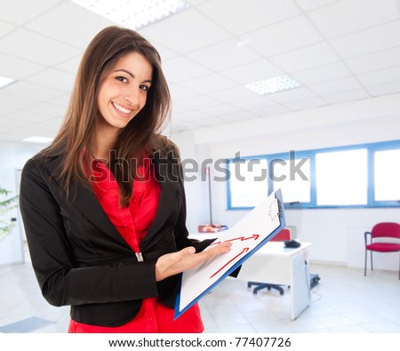 Businesswoman showing a positive business report