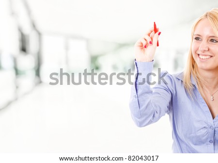 Woman with a red marker in the hand. You can write your own text.