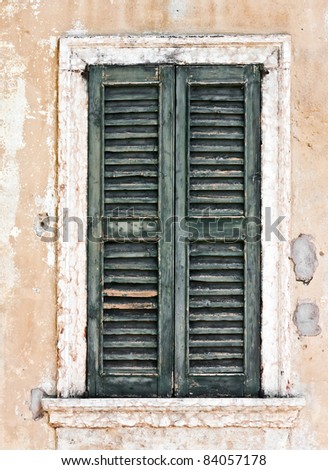 Grungy old green wooden window