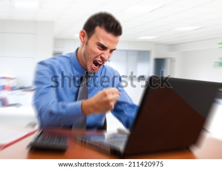 Angry man yelling at his computer
