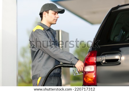 Smiling worker at the gas station
