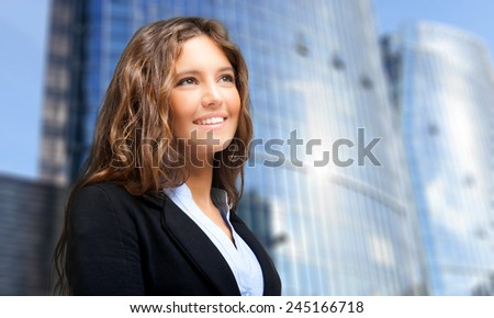 Successful young woman looking straight forward in an urban setting