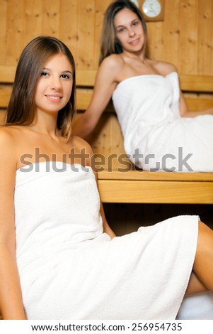Young women relaxing in a sauna