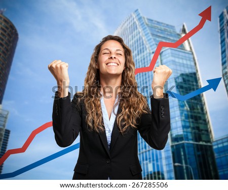 Portrait of a really happy businesswoman. Rising arrow in the background, representing business growth