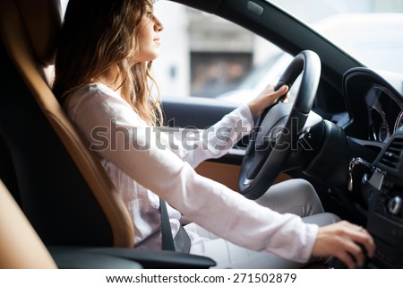 Young woman driving her car