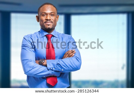 Smiling black businessman in the office