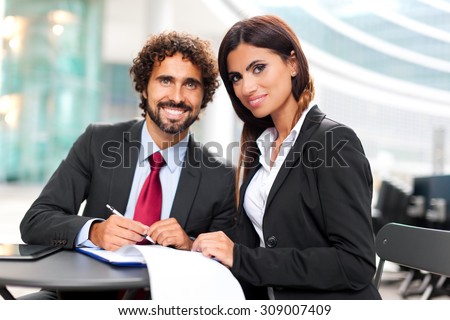 Business people signing a contract