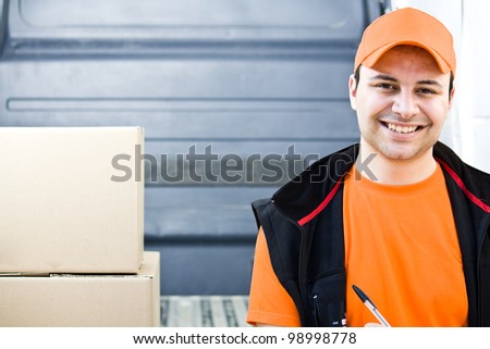 Smiling guy delivering a parcel