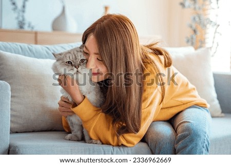 Similar – Image, Stock Photo Young woman hugging cat in hallway