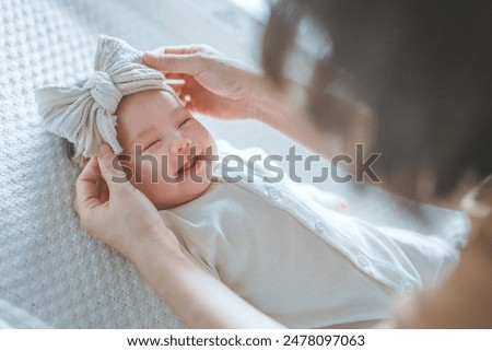 Similar – Image, Stock Photo Little cute baby girl lying in basket