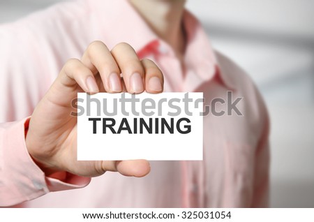 Training text on the card in hand man.