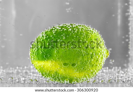 Beautiful lime in the water with bubbles of gas. design element