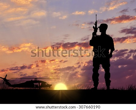 Soldier Silhouette Military helicopter against the evening sunset in the rays of the sun. Elesment design