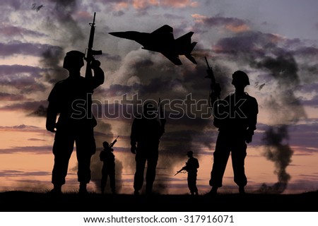 Concept of war. Silhouettes of military soldiers with guns and fighter against the backdrop of explosions and smoke