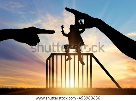 Feminism and discrimination. Silhouette, woman's hand throws in a cage man, condemning him