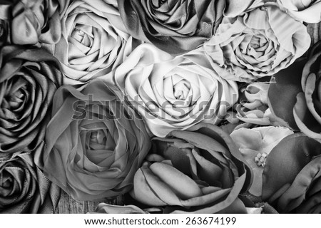 Black and white image of vintage handmade flowers background. selective focus