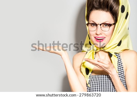 Glamorous retro lady pointing with fingers, showing