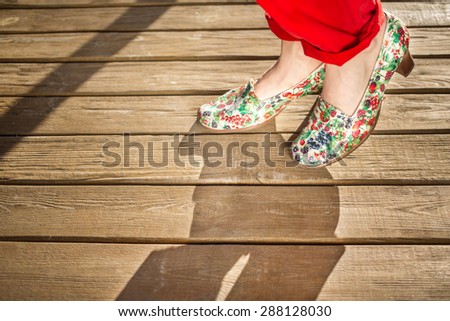 Woman legs in bright shoes outdoor shot, shoes is decorated in decoupage style by me