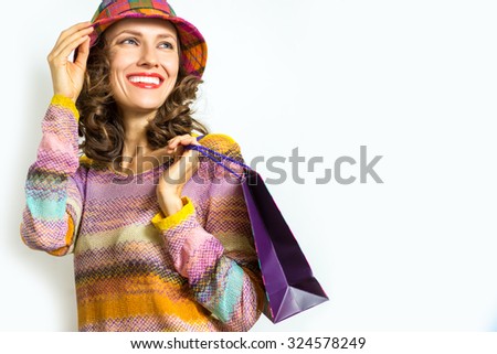 Beautiful shopping woman  in autumn colors over white background