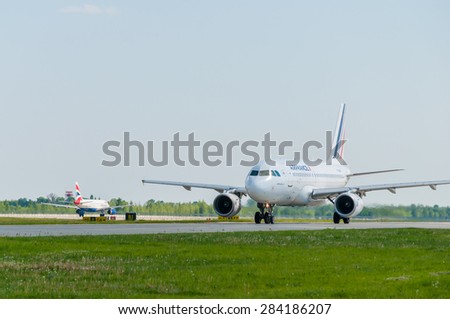KIEV, UKRAINE - MAY 20, 2015: Air France Airbus A319-131 and British Airways  Boeing are taxiing at Borispol International Airport.  Air France is rated top 10 biggest airlines in the world.