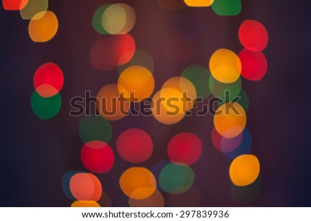 circles of bright lights in the dark. Bokeh background.