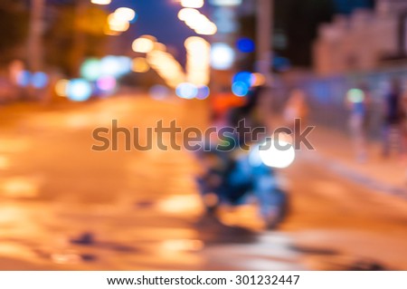 Abstract blurred slow motion, biker riding motorbike, driver racing bike, side view, blur movement, summer night road trip, speed concept.