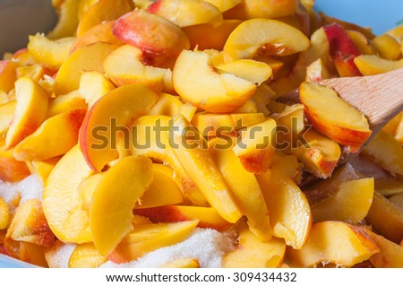 Ripe peach  fruit slice with juice. Cooking jam or marmalade background.