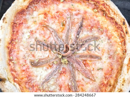Anchovies pizza in a oven pan