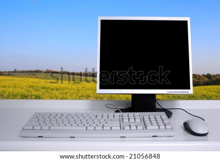 PC with black desktop and green field background