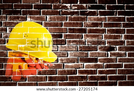 Yellow hard hat and  protective gloves painted on a grunge wall. Nice industrial concept background.