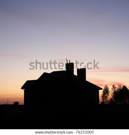 House silhouette with gorgeous sunset sky background