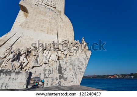 LISBON - MAY 3, 2010: Unknown people by statues of the Monument to Discoveries in Lisbon Harbor honoring Portugal\'s explorers on May 3, 2010 in Lisbon a city highly rated for inexpensive vacations.