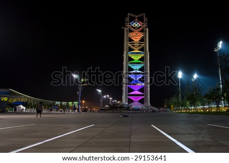 BEIJING, CHINA - AUG 16: Olympic tower with 5 Olympic rings lit up at night during the Summer Olympics August 16, 2008 Beijing, China.