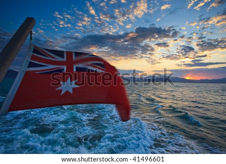 Leaving Cairns Harbor for dive trip Australian Flag