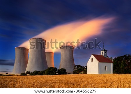 Dukovany cooling towers of nuclear power plant and a chapel