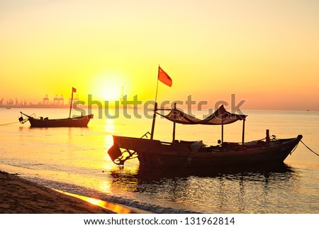 Morning on the yellow sea. Fishing boats are at sea.