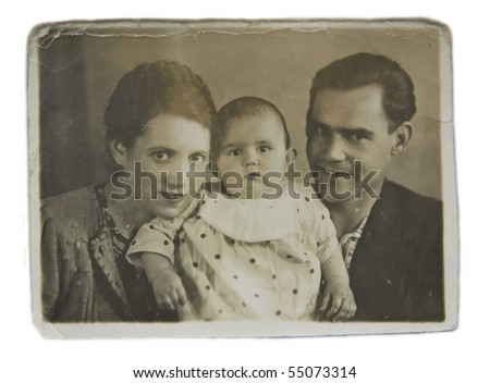 Family portrait of a young couple with a child, an old picture