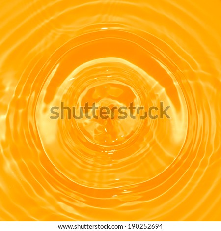 Abstract orange juice circle water drop ripple. Liquid splash texture background