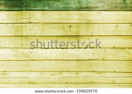 Green yellow wood plank wall texture background.