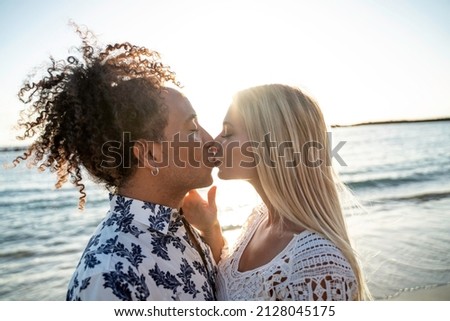 Similar – Image, Stock Photo Positive multiethnic couple kissing on street